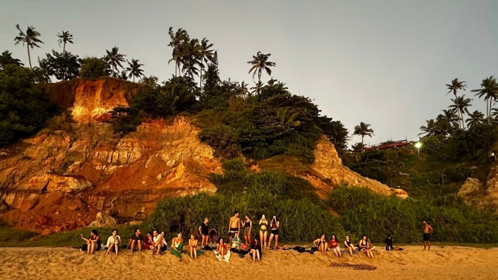 sunset-beach-gathering-yoga-students-varkala-kerala-devvrat-yoga-sangha